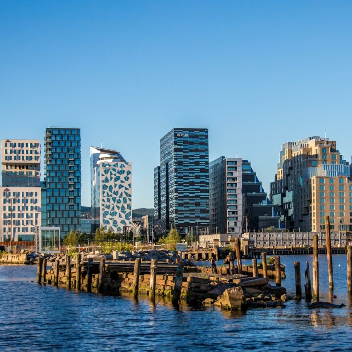 body of water near city buildings during daytime