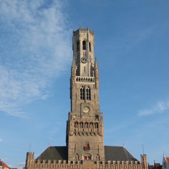 a very tall building with a clock on it's side