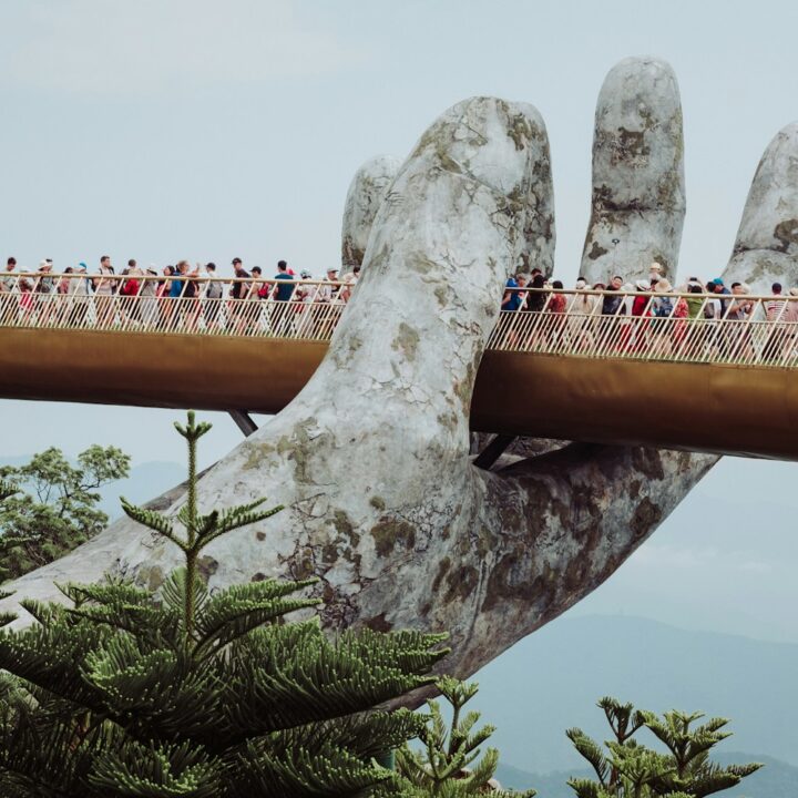 people walking on bridge during daytime