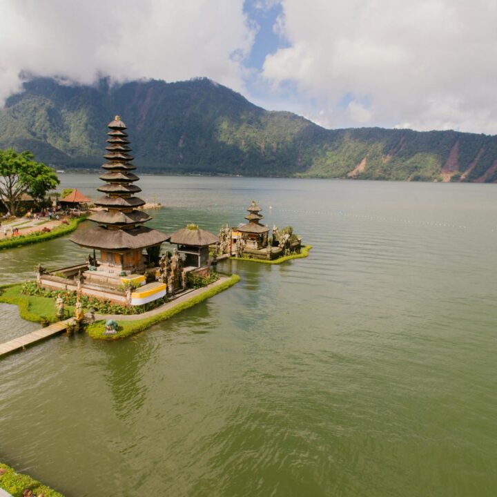 A stunning aerial view of Pura Ulun Danu Bratan Temple situated by a serene lake in the highlands of Bali, Indonesia.